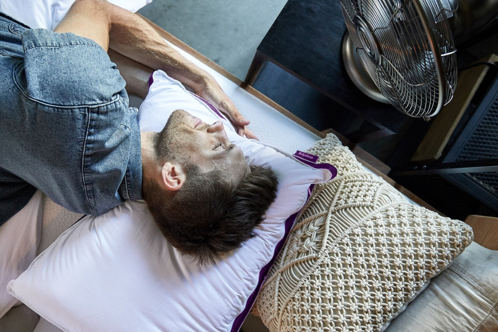 Man with his head resting on a Polysleep pillow