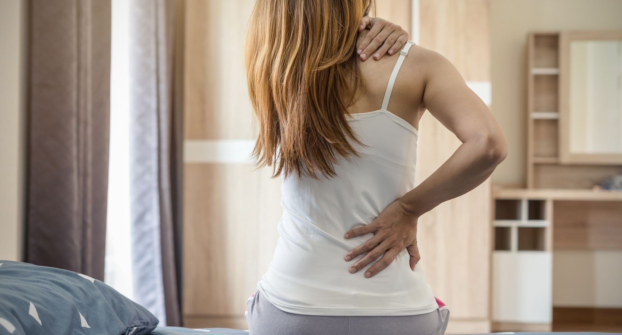 Lady with a sore upper back