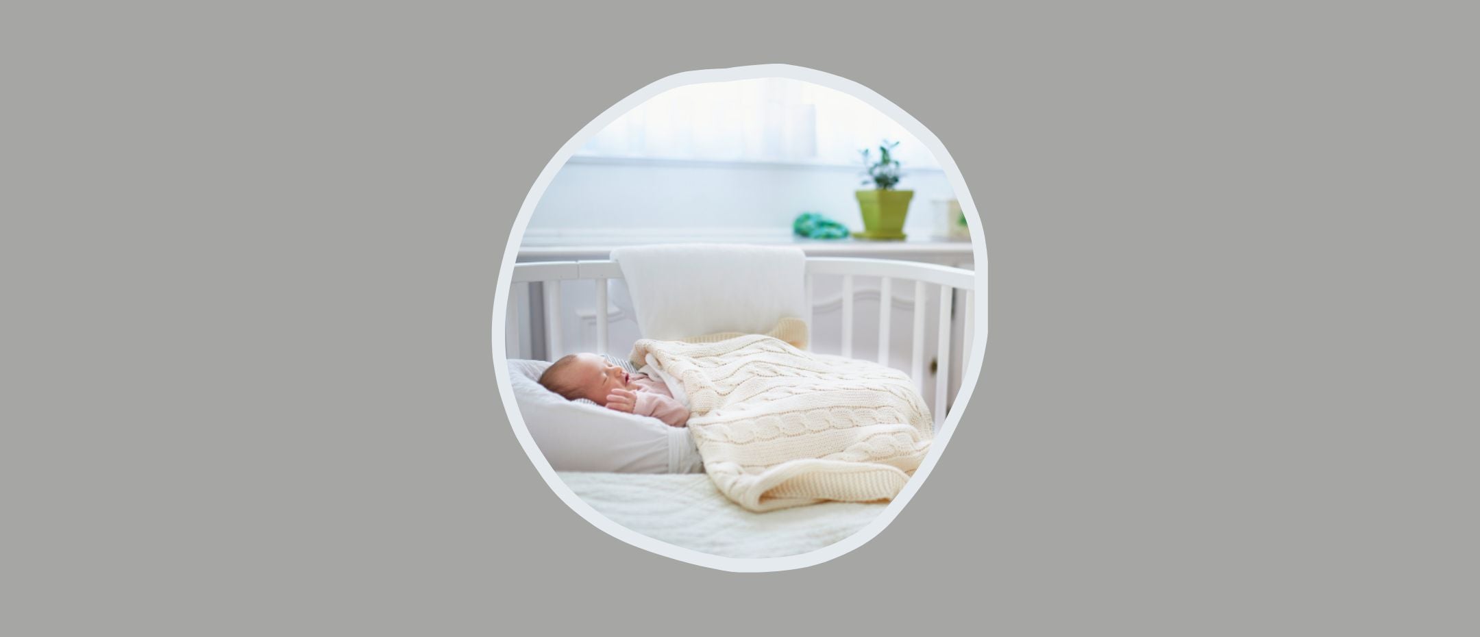 Baby sleeping in a crib next to a bed.