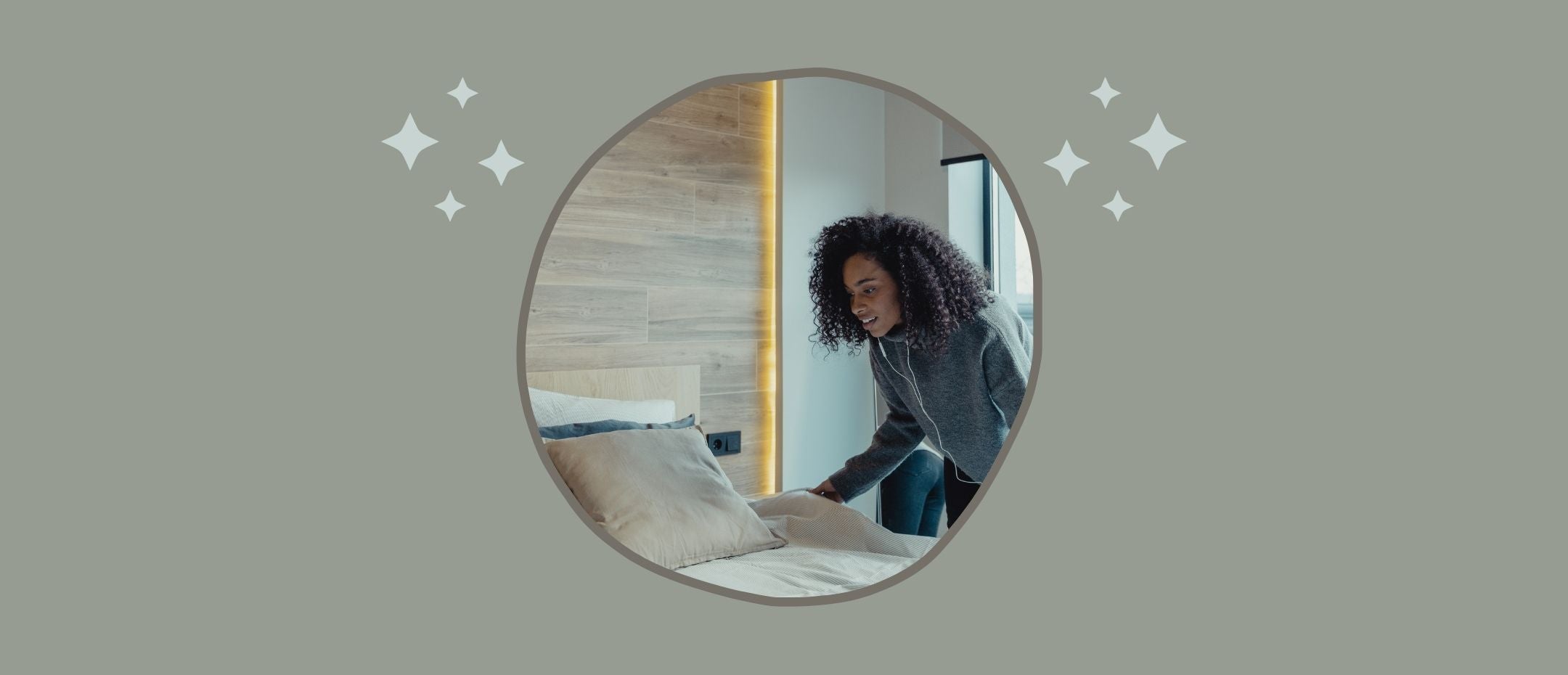 woman admiring the beddings of her clean bed after washing