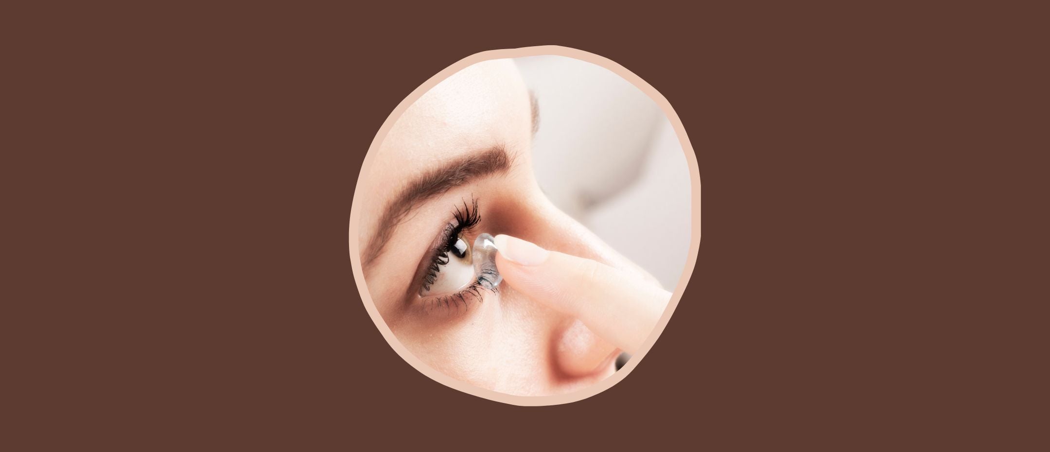 close-up of a woman placing her contact lens