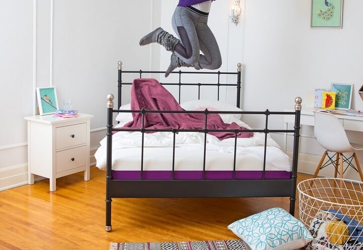 A client jumps for joy on his Polysleep foam mattress