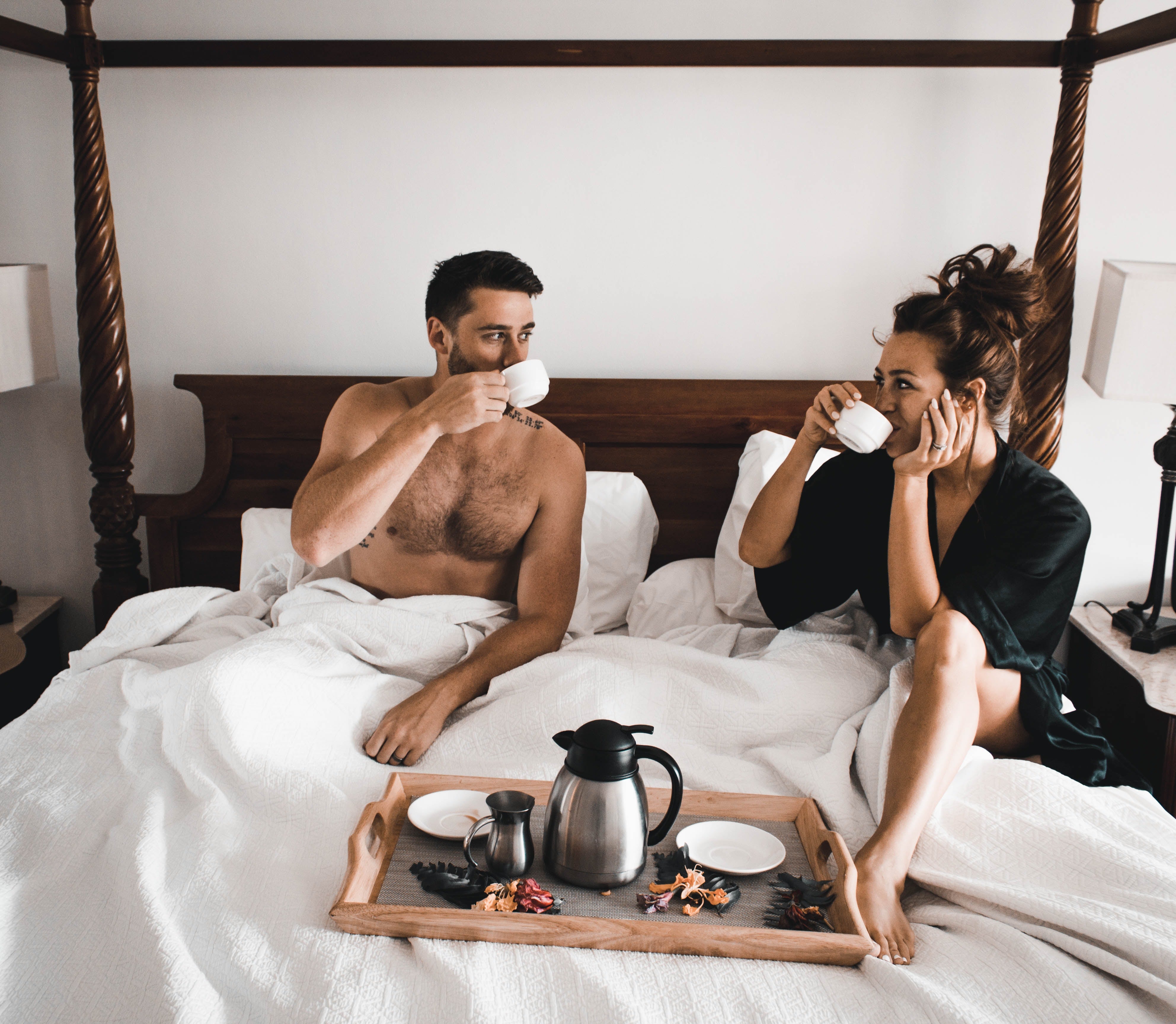 Couple having coffee in bed