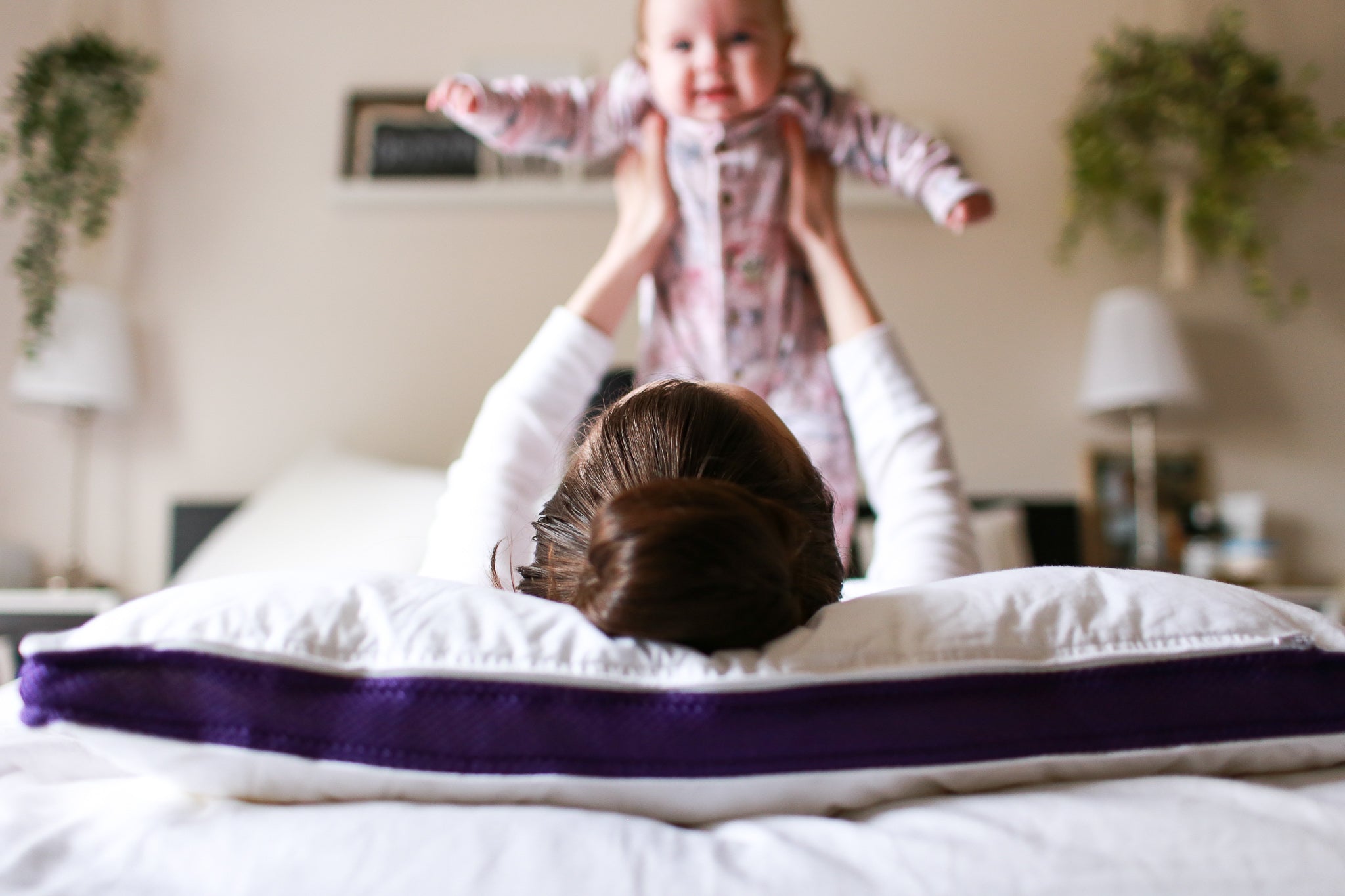 Mom and her baby having fun on a Polysleep Mattress.