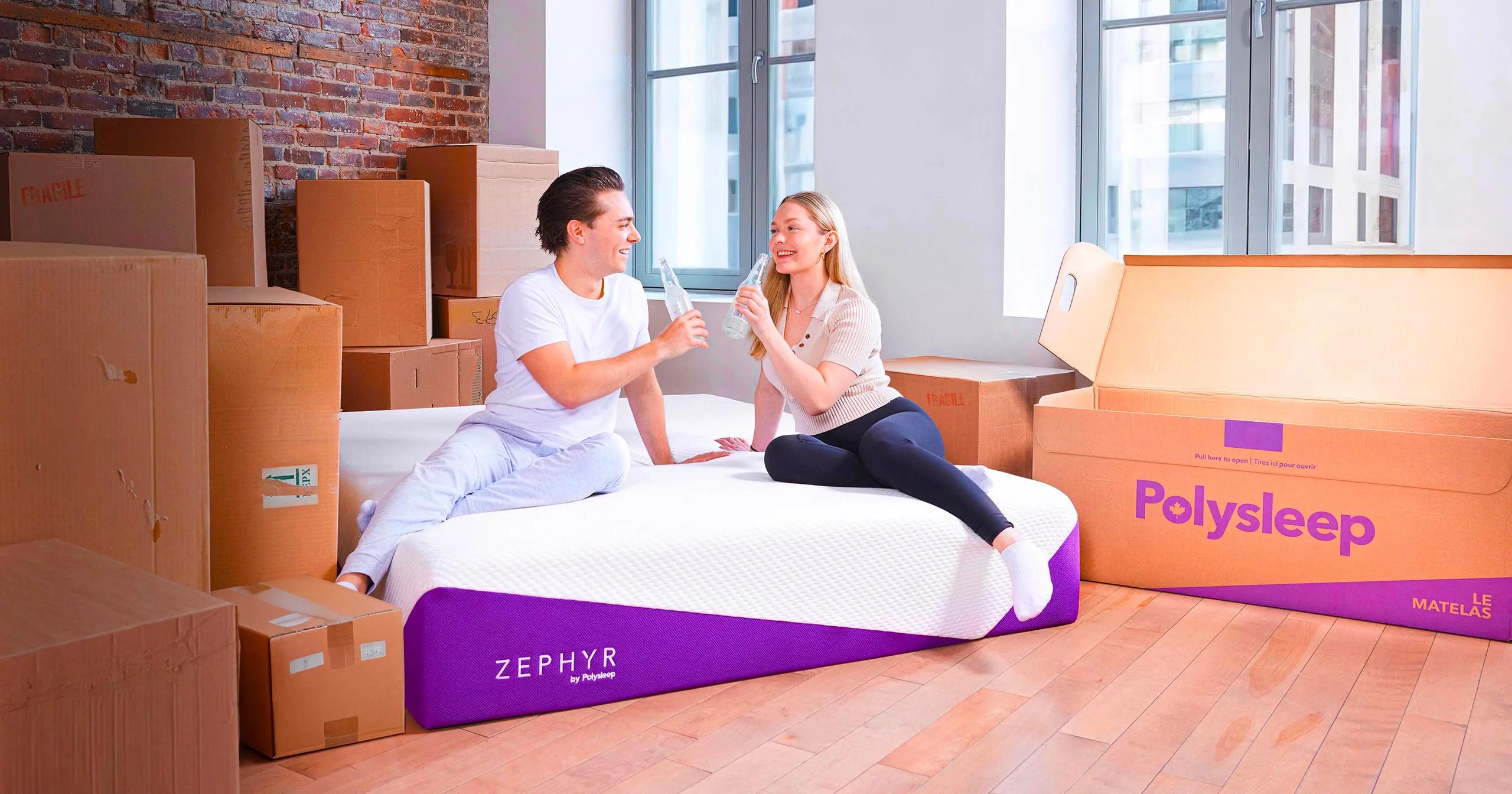 Moving boxes next to a Polysleep mattress